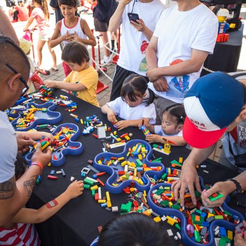 People building lego in the kids zone