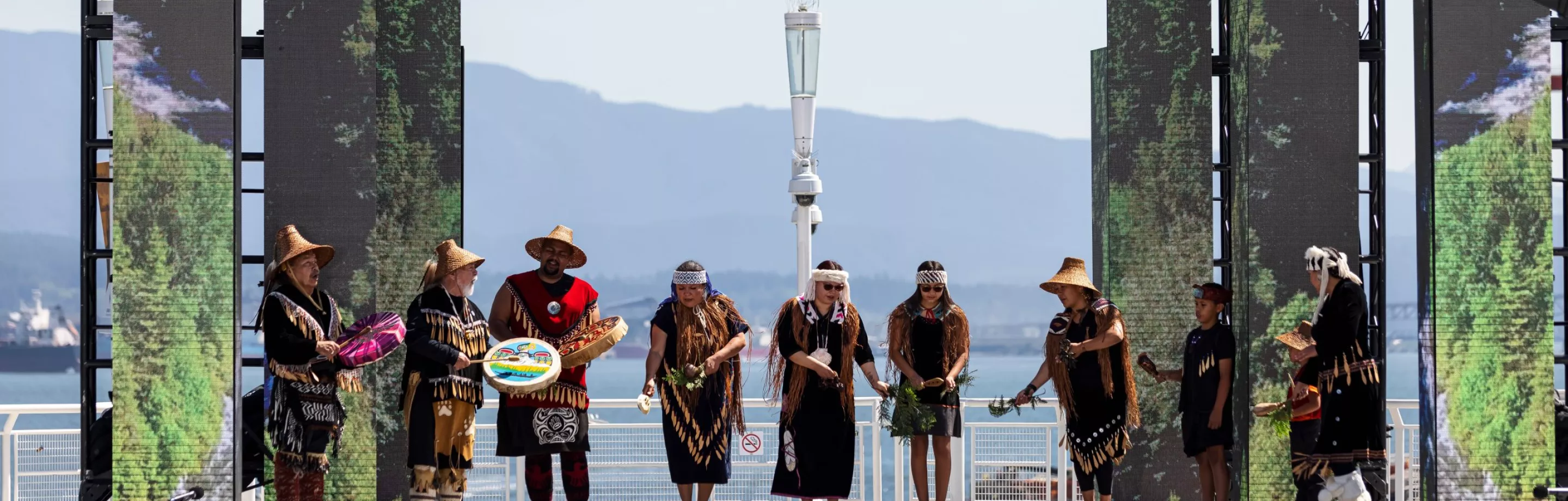 Indigenous peoples performing on stage