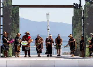 Indigenous peoples performing on stage