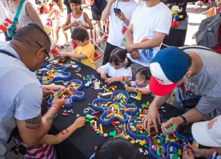 People building lego in the kids zone