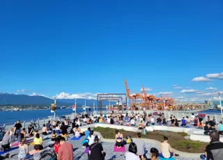 People doing yoga at Canada Place