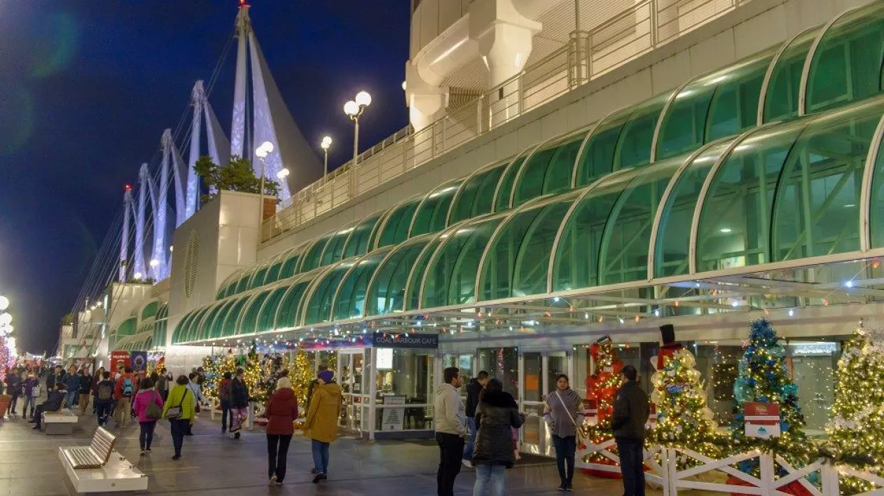 Crowds of people enjoying Christmas trees at Canada Place